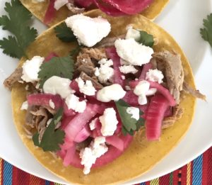 These Pork Carnitas Tacos have shredded pork tenderloin topped with pickled red onions, goat cheese & tangy cilantro lime crema. On the side, Creamy Corn with goat cheese...wha!?!? Yep, goat cheese is tangy, sweet, salty and oh-so-creamy for an unexpected, but absolutely delicious combination!