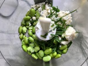 All ingredients in a food processor for Edamame Dip with Gorgonzola. It's creamy, savory, nutty, and utterly delicious!