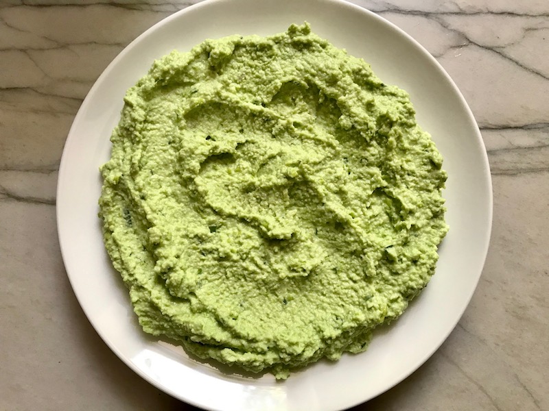 Edamame Dip with Gorgonzola spread on a plate. It's creamy, savory, nutty, and utterly delicious!