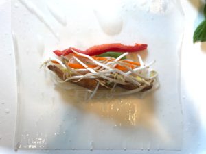 These Teriyaki Chicken Summer Rolls with Garlic Honey Soy Dipping Sauce are easy, fun, and delicious! Teriyaki Chicken strips are layered with Rice noodles, carrots, red pepper, bean sprouts and basil. All get rolled up in a light moistened rice paper. What you get is this bite of freshness that you dip into the sweet, tangy, and salty Garlic Honey Soy Sauce. These are a Summer delight! #chicken #summerrolls #springrolls #glutenfree