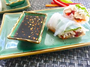 These Teriyaki Chicken Summer Rolls with Garlic Honey Soy Dipping Sauce are easy, fun, and delicious! Teriyaki Chicken strips are layered with Rice noodles, carrots, red pepper, bean sprouts and basil. All get rolled up in a light moistened rice paper. What you get is this bite of freshness that you dip into the sweet, tangy, and salty Garlic Honey Soy Sauce. These are a Summer delight! #chicken #summerrolls #springrolls #glutenfree