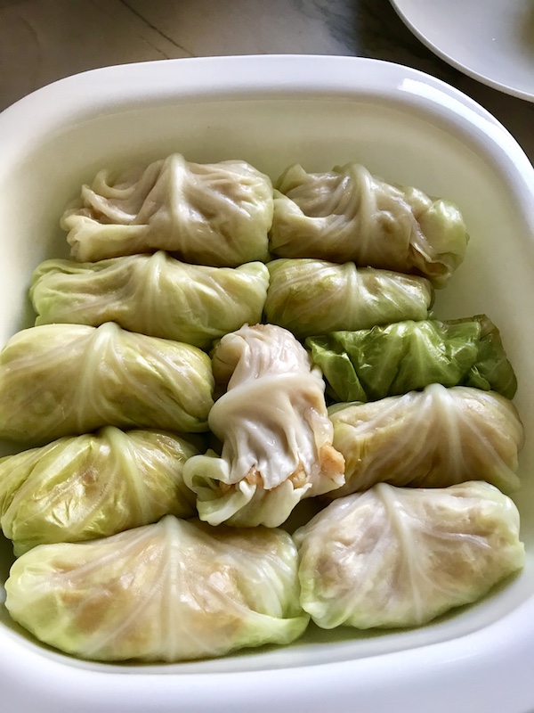 These Stuffed Cabbage Rolls (Golumpki!) are a great make-ahead family dish! This recipe uses ground chicken, paprika, parmesan, tomato paste, garlic, and onion for tons of flavor!