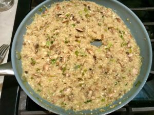 Thickened Mushroom Quinoa risotto in frying pan for Creamy Parmesan Mushroom Quinoa Risotto.