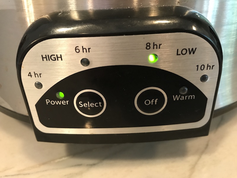 Crockpot slow cooker settings panel showing the 8hr Low setting as green.