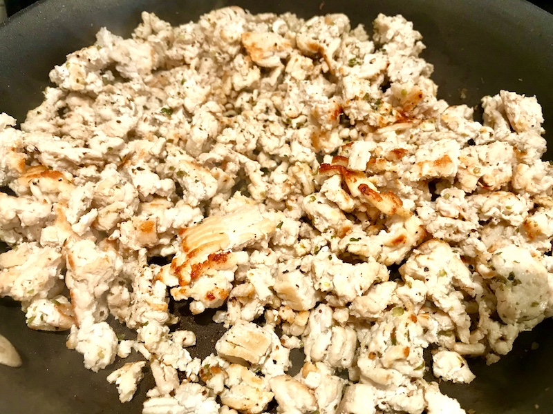 Ground chicken cooking in a skillet for Ground Chicken Ragu.