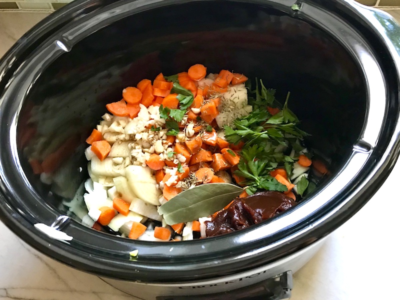 Easy Slow Cooker Short Ribs ingredients Short Ribs ingredients all added to the slow cooker: carrots, onions, demi-glace, bay leaf, parsley, garlic for flanken short ribs recipe slow cooker.