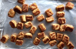 Baked Cauliflower Tater Tots on baking sheet
