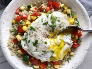 This 5-ingredient Sunny Quinoa with Fried Egg & Veggie Medley is simple, but incredible. The Veggie Medley is a trifecta of red pepper, zucchini, and sweet corn that are roasted on a sheet pan. Then on top of it all is a salty fried egg with a runny yoke that oozes out to bring a deep creaminess to the entire dish.