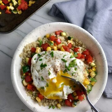 This 5-ingredient Sunny Quinoa with Fried Egg & Veggie Medley is simple, but incredible. The Veggie Medley is a trifecta of red pepper, zucchini, and sweet corn that are roasted on a sheet pan. Then on top of it all is a salty fried egg with a runny yoke that oozes out to bring a deep creaminess to the entire dish.