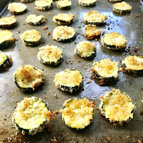 Parmesan Zucchini chips cooked on pan. so easy to learn how to roast zucchini slices.