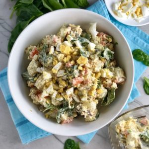 This Fully Loaded Potato Salad has salty bacon and cheddar cheese, creamy and rich egg, fresh scallions and baby spinach, and crunchy carrots. The dressing is simple with a blend of yellow mustard and mayo. Make ahead and enjoy later! YUMM-Y!