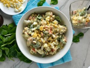 This Fully Loaded Potato Salad has salty bacon and cheddar cheese, creamy and rich egg, fresh scallions and baby spinach, and crunchy carrots. The dressing is simple with a blend of yellow mustard and mayo. Make ahead and enjoy later! YUMM-Y!