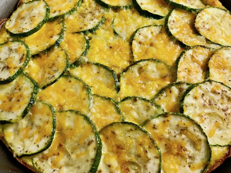 Vegetable Frittata with Lemon Crema is an easy weeknight dinner, quick breakfast, or weekend brunch recipe! This Vegetable Frittata is thick and hearty with lots of flavors and textures from the veggies, but is also light and creamy from the eggs and cheese. It's loaded with healthy veggies, is gluten free, and super EASY to make and to clean up after.