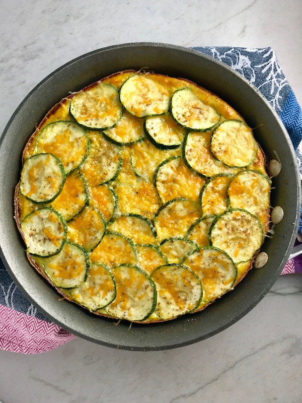 Vegetable Frittata with Lemon Crema is an easy weeknight dinner, quick breakfast, or weekend brunch recipe! This Vegetable Frittata is thick and hearty with lots of flavors and textures from the veggies, but is also light and creamy from the eggs and cheese. It's loaded with healthy veggies, is gluten free, and super EASY to make and to clean up after.