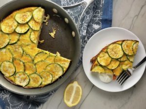 Vegetable Frittata with Lemon Crema is an easy weeknight dinner, quick breakfast, or weekend brunch recipe! This Vegetable Frittata is thick and hearty with lots of flavors and textures from the veggies, but is also light and creamy from the eggs and cheese. It's loaded with healthy veggies, is gluten free, and super EASY to make and to clean up after.