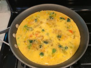 Vegetable Frittata with Lemon Crema is an easy weeknight dinner, quick breakfast, or weekend brunch recipe! This Vegetable Frittata is thick and hearty with lots of flavors and textures from the veggies, but is also light and creamy from the eggs and cheese. It's loaded with healthy veggies, is gluten free, and super EASY to make and to clean up after.