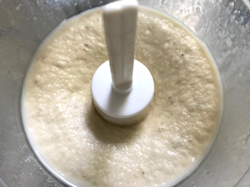 Banana Ice Cream blended in food processor. Banana Ice Cream is literally just 2 ingredients, Frozen Bananas and Almond Milk. Add in crunchy Graham Crackers as the 3rd ingredient and you have a delicious healthy Banana Ice Cream Sandwich! If you have never tried banana ice cream, you are in for a treat! It tastes just like soft serve ice cream.