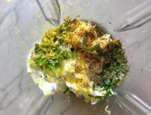 Lemon zest & juice, basil, chives, yogurt, oil all in blender before blending. This Basil & Chive Yogurt Dressing with Lemon and Honey is creamy, light, savory, and a little bit sweet. It takes only minutes to make this delicious homemade dressing. Basil & Chive Yogurt Dressing is perfect for salads, for drizzling over roasted veggies, steak, chicken, or fish, and amazing for dipping fries into!!