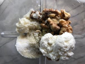 All ingredients in a blender for the Walnut Sauce: garlic, walnuts, milk-soaked bread, ricotta, parmesan. This Walnut Sauce recipe with Ricotta and Spinach is thick, rich, nutty, and creamy.  It's inspired by the traditional Italian Walnut Sauce from the North-Western Italy, Liguria Region, but my Walnut Sauce recipe adds even more decadence with creamy ricotta and more nutty parmesan cheese.