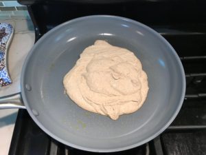 Walnut Cream sauce added from the blender to a large skillet. This Walnut Sauce recipe with Ricotta and Spinach is thick, rich, nutty, and creamy.  It's inspired by the traditional Italian Walnut Sauce from the North-Western Italy, Liguria Region, but my Walnut Sauce recipe adds even more decadence with creamy ricotta and more nutty parmesan cheese.