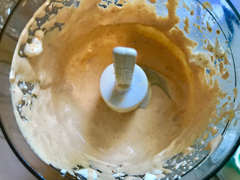 Mexican Pasta Salad dressing blended in food processor. This Creamy Mexican Pasta Salad has Sun Dried Tomatoes, Corn, Fresh Diced Tomatoes, Cilantro, and smoky Mexican spices. The dressing is creamy and smoky with lots of depth and a hint of sweetness from the Sun Dried Tomatoes that are blended in. Terrific as a side or mix in some chicken or beef and call it a meal!