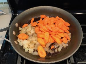 Carrot slices added to onions in skillet. Smothered Pork Chop Casserole is a true midwestern comfort dish with layers of vegetables and meaty pork chops smothered in a creamy sauce and cheese. The pork chops in this delicious casserole are left whole so that you get an entire portion dripping in goodness in one scoop.