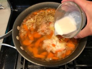 Cornstarch slurry being poured over broth with carrots and onions. Smothered Pork Chop Casserole is a true midwestern comfort dish with layers of vegetables and meaty pork chops smothered in a creamy sauce and cheese. The pork chops in this delicious casserole are left whole so that you get an entire portion dripping in goodness in one scoop.