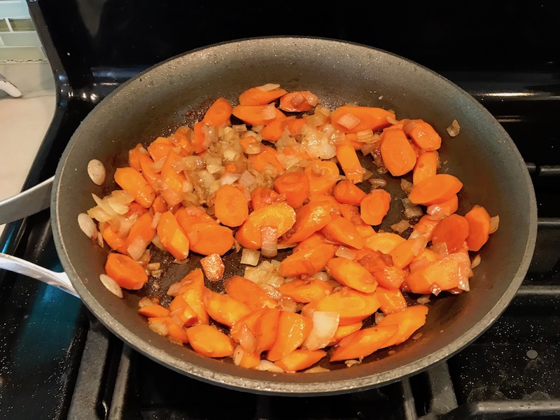 Cooked carrots, onions, garlic in skillet. Smothered Pork Chop Casserole is a true midwestern comfort dish with layers of vegetables and meaty pork chops smothered in a creamy sauce and cheese. The pork chops in this delicious casserole are left whole so that you get an entire portion dripping in goodness in one scoop.