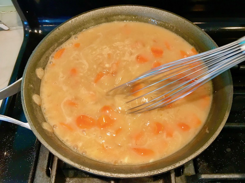 Whisking thickened sauce with carrots and onions in skillet. Smothered Pork Chop Casserole is a true midwestern comfort dish with layers of vegetables and meaty pork chops smothered in a creamy sauce and cheese. The pork chops in this delicious casserole are left whole so that you get an entire portion dripping in goodness in one scoop.