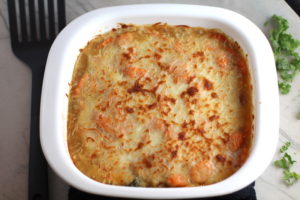 Casserole with melted and browned cheese on top. Smothered Pork Chop Casserole is a true midwestern comfort dish with layers of vegetables and meaty pork chops smothered in a creamy sauce and cheese. The pork chops in this delicious casserole are left whole so that you get an entire portion dripping in goodness in one scoop.