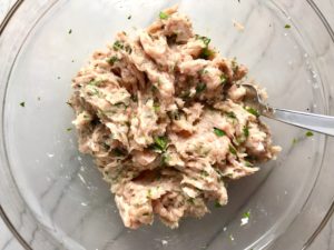 Ground Italian Chicken Sausage mixed in a bowl for Hanky Panky Appetizers.