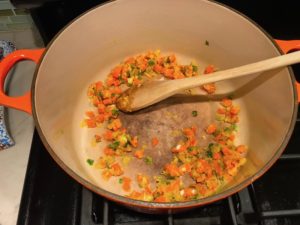 Diced carrots and scallions mixed with flour in pot for Stove top Easy Tuna Casserole. This is a creamy and delicious comfort dish with tuna and noodles and a surprise pop of sweet from Pimiento. This easy recipe is completely from scratch (no canned soup here!) but I can promise you it's so easy and only takes 30 minutes because it's a Casserole that you can make entirely on the stove top!