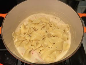 Add Noodles to sauce in pot for Easy Tuna Casserole. This is a creamy and delicious comfort dish with tuna and noodles and a surprise pop of sweet from Pimiento. This easy recipe is completely from scratch (no canned soup here!) but I can promise you it's so easy and only takes 30 minutes because it's a Casserole that you can make entirely on the stove top!