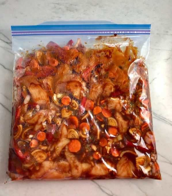 Hoisin Chicken and veggies in a freezer bag about to be frozen.
