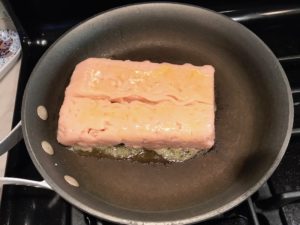 Raw ground chicken in skillet for Moroccan Chicken Chili with Chickpeas is loaded with comforting and healthy ingredients and spices. You get warmth from Ginger, Turmeric, Garlic, and Coriander. Then tons of hearty flavor from browned ground chicken and Shallots. And creaminess from the Carrots and Chickpeas. You can make it ahead and freeze it until you are ready to cook it!