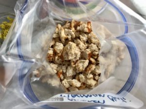 Cooked and browned chicken added to freezer bag on counter for Moroccan Chicken Chili with Chickpeas is loaded with comforting and healthy ingredients and spices. You get warmth from Ginger, Turmeric, Garlic, and Coriander. Then tons of hearty flavor from browned ground chicken and Shallots. And creaminess from the Carrots and Chickpeas. You can make it ahead and freeze it until you are ready to cook it!