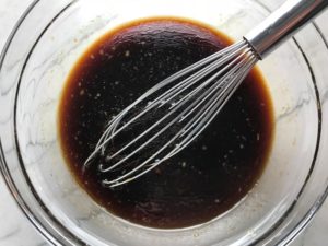 Mixed Soy Sauce for Asian Lettuce Wraps. They are a fantastic way to use leftover Turkey or Chicken transforming it with new delicious flavors and textures. The turkey is stir fried with carrots, red pepper, and brussel sprouts in a flavorful ginger, garlic, & sesame sauce. It's layered in lettuce wraps with rice and a cool, crunchy purple cabbage sesame slaw. Serve with a Garlic Honey Soy Sauce....YUM!!!