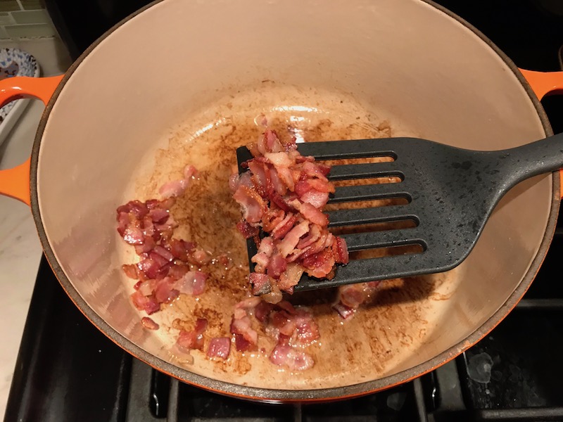 Cooked bacon in pot for the Easy Bacon Brussel Sprouts and Chicken recipe. It's a perfect quick Fall Recipe! It has a creamy sauce filled with salty bacon, earthy and almost nutty seared brussel sprouts, and hearty healthy chicken. Serve over rice (or Quinoa or pasta!).