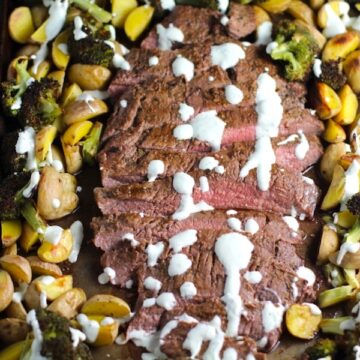 Flank Steak sliced with Potatoes & Broccoli on sheet pan with crema drizzled on top. This is an easy and delicious Sheet Pan Dinner. The homemade steak rub adds such wonderful flavor. To top this sheet pan dinner, you get this tangy, light Garlic Chive Crema! Best of all, you only need 1 pan so it's a super easy clean up. Easy and Delicious!
