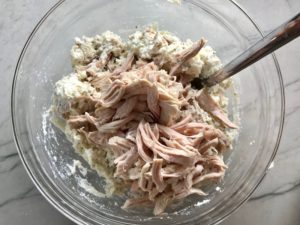 Shredded Turkey added to Ricotta Filling for Turkey Ricotta Stuffed Shells in Tomato Sauce. They are the perfect way to repurpose and transform leftover Turkey or Chicken. The Shredded Turkey, Italian seasonings, mozzarella, and ricotta are stuffed in shells and topped with a simple tomato sauce and more melty mozzarella and nutty parmesan, it's a perfect dish that the family will love!