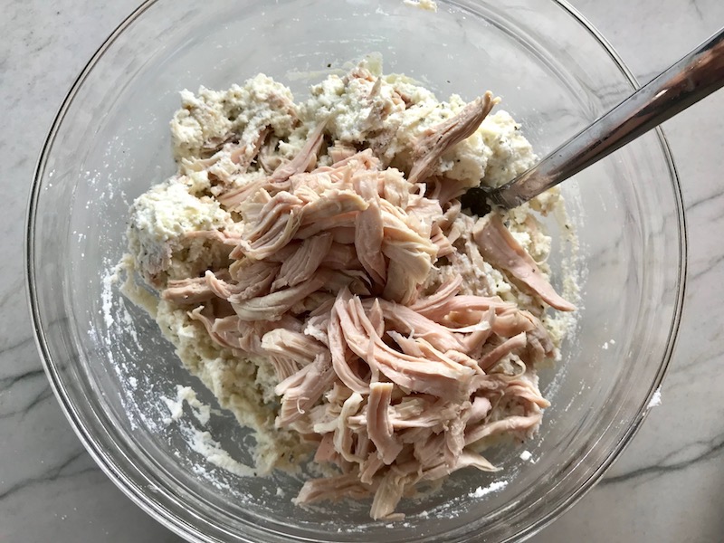 Shredded Turkey added to Ricotta Filling for Turkey Ricotta Stuffed Shells in Tomato Sauce. They are the perfect way to repurpose and transform leftover Turkey or Chicken. The Shredded Turkey, Italian seasonings, mozzarella, and ricotta are stuffed in shells and topped with a simple tomato sauce and more melty mozzarella and nutty parmesan, it's a perfect dish that the family will love!