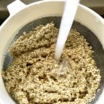 Quinoa being rinsed for the Tomato Tart Recipe. It gives you crunch from the Quinoa crust, a burst of fresh from the tomatoes, tons of flavor from the basil and garlic, tang and meatiness from the artichoke and so much creaminess from the mozzarella and goat cheese! It's addictive and delicious!