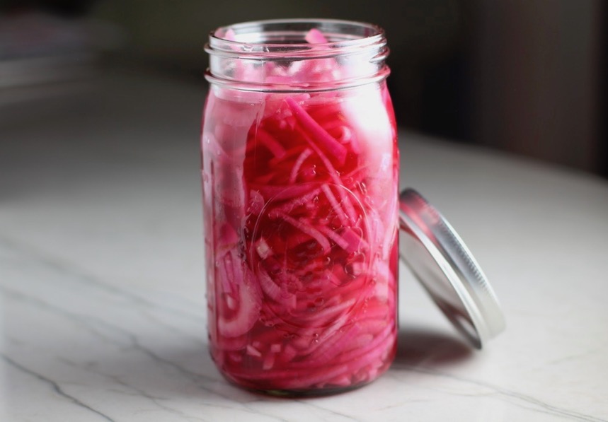 Pickled Onions for Slow Cooker Pork Tacos with with Pickled Onions, Shredded Cheese, and Cilantro Lime Crema drizzled on top! It's such an easy dinner since the pork cooks in the slow cooker to be perfectly seasoned and fall apart tender. #tacos #easydinner #glutenfree #dinner #mexican #pork