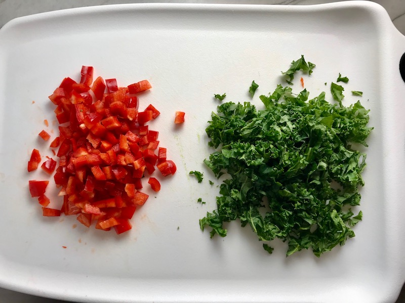Chopped Red Pepper and Kale for Quinoa & Kale Salad with Roasted Chickpeas, Pomegranate, Feta, red pepper, and Creamy Lemon Dressing. #glutenfree #lunch #dinner #healthyrecipes #healthyfood #salads #quinoa #kale