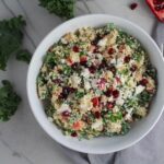Bowl of Quinoa & Kale Salad with Roasted Chickpeas, Pomegranate, Feta, red pepper, and Creamy Lemon Dressing. #glutenfree #lunch #dinner #healthyrecipes #healthyfood #salads #quinoa #kale