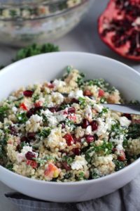 Close up of bowl of Quinoa & Kale Salad with Roasted Chickpeas, Pomegranate, Feta, red pepper, and Creamy Lemon Dressing. #glutenfree #lunch #dinner #healthyrecipes #healthyfood #salads #quinoa #kale