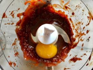 Chipotle peppers in adobo, ketchup, and egg in food processor for Chipotle Meatloaf. Cheddar Cheese gives depth and more flavor. It's incredibly easy, incredibly moist, and incredibly delicious! A family dinner favorite! #meatloaf #mexican #easydinner #familydinner #dinner #easyrecipes #beef