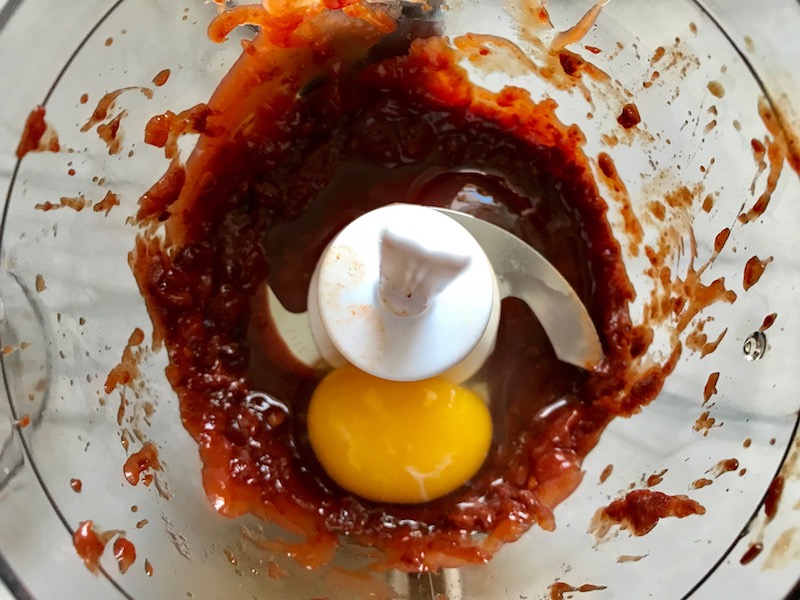 Chipotle peppers in adobo, ketchup, and egg in food processor for Chipotle Meatloaf. Cheddar Cheese gives depth and more flavor. It's incredibly easy, incredibly moist, and incredibly delicious! A family dinner favorite! #meatloaf #mexican #easydinner #familydinner #dinner #easyrecipes #beef