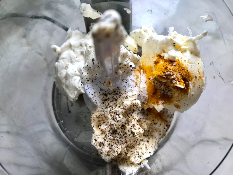 Sour cream, Cream Cheese, May, salt, pepper, and curry in food processor for Curry Chicken Salad with raisins. It has so many fantastic flavors and textures! The chicken breast is simply roasted and mixed with a creamy sweet and savory curry dressing. Red pepper gives you a fresh crunch, scallion gives a savory bite, and raisins give a burst of sweet. #chicken #chickenrecipes #chickensalad #currychicken #mealprep #lunch #healthyrecipes