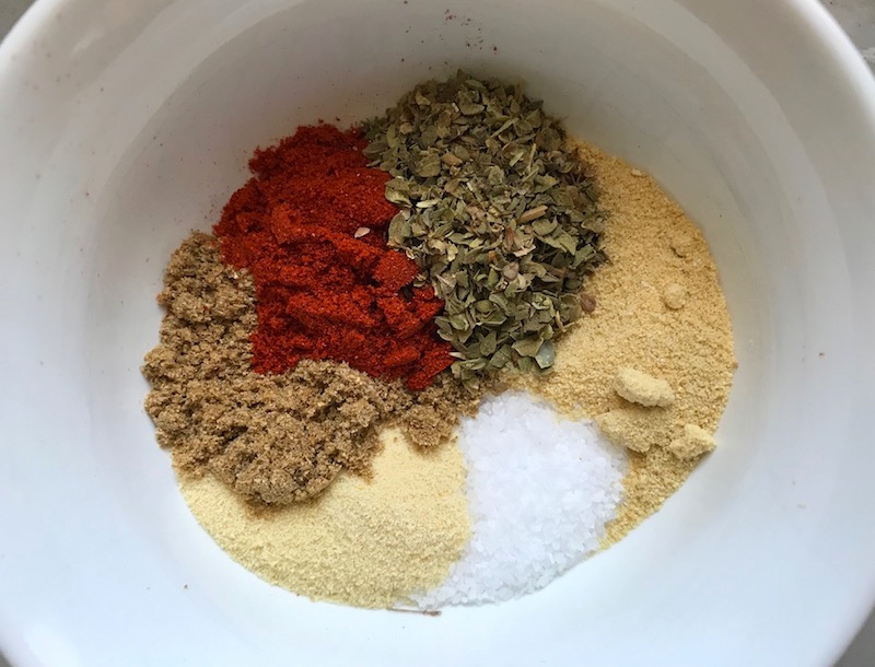 Spices in bowl for Roasted Tofu Croutons. These are seasoned and toasted for the perfect addition to any salad, pasta, rice, or soup! They get a roasted, almost nutty flavor with a salty and smoky seasoned crust with a chewy bite. Super easy to make, low carb and great source of protein! #croutons #salad #tofu #tofurecipes #vegetarian #plantbased #paleo